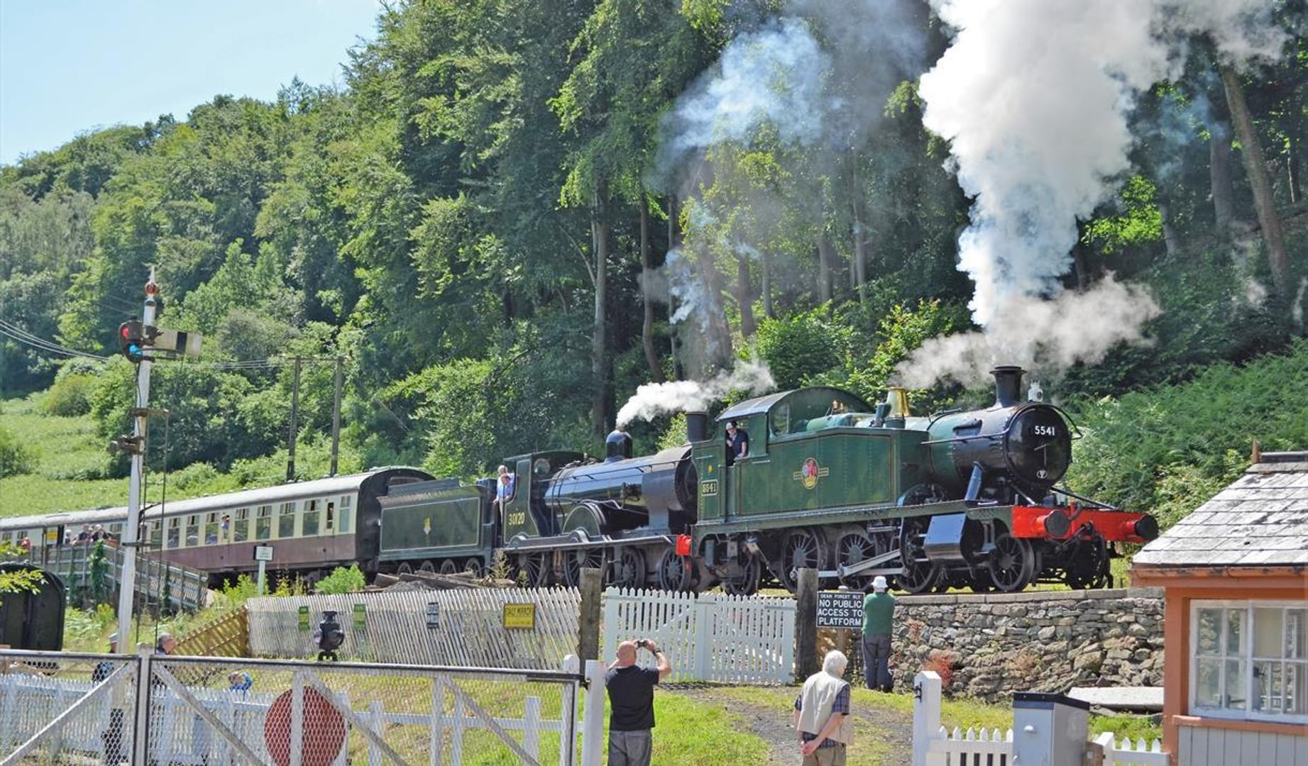 Dean Forest Railway in the Summer showing the steam train leaving the station