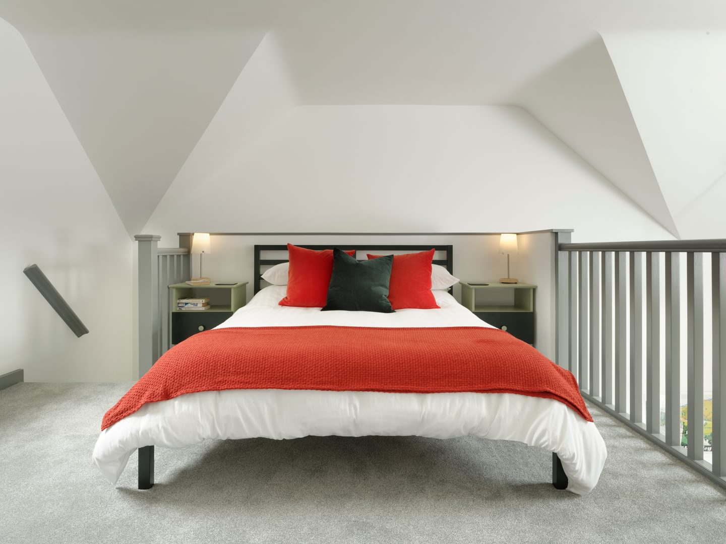 Rock Lodge Symonds Yat Rock Lodge holiday apartments. Modern mezzanine bedroom with architecturally interesting high ceiling. White-painted with bright furnishings.011