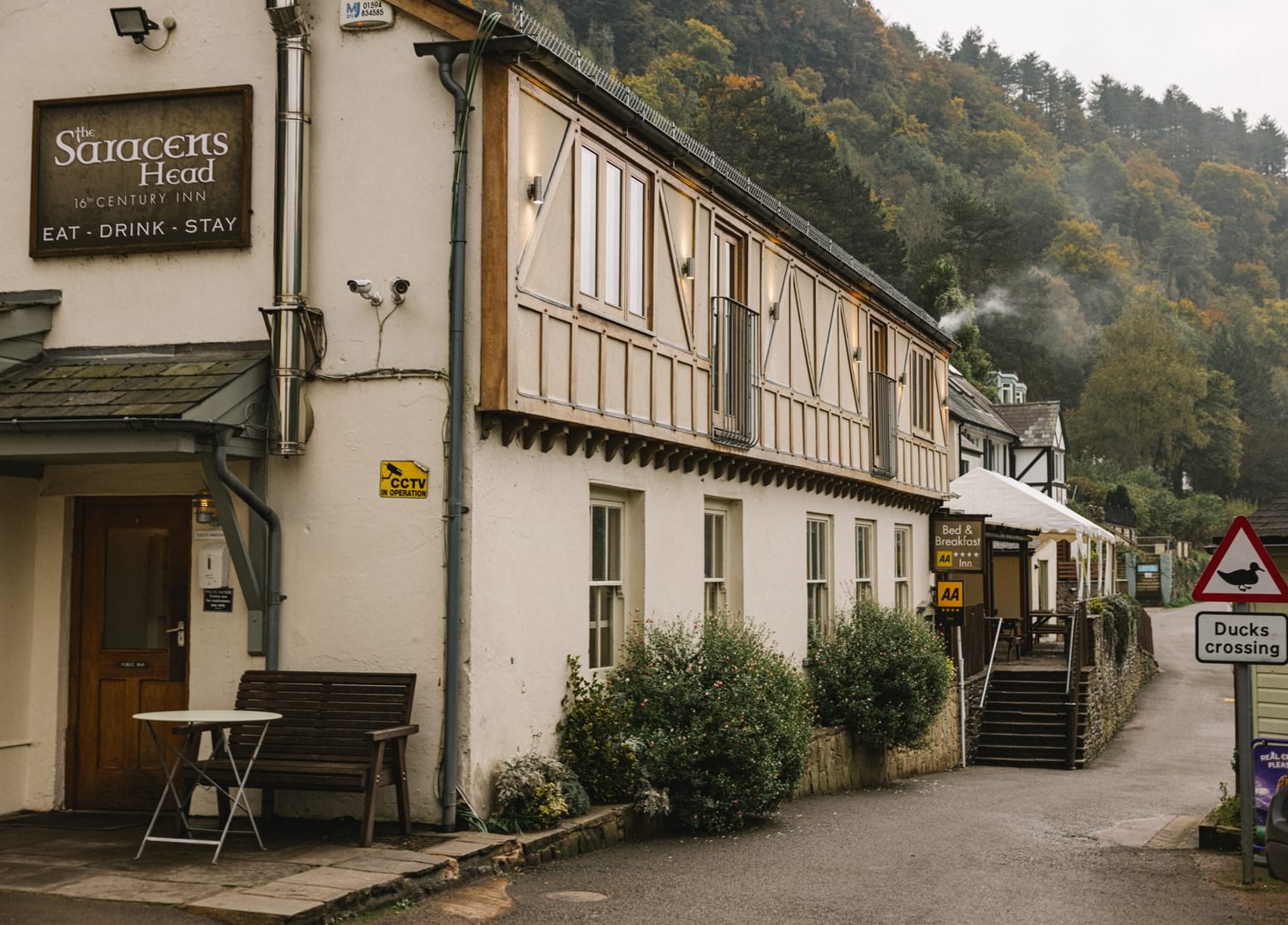 The Saracens Head Inn, Symonds Yat East, with 'Ducks Crossing' sign. A 16th Century half-timbered pub next to the River Wye with an ancient hand ferry crossing.