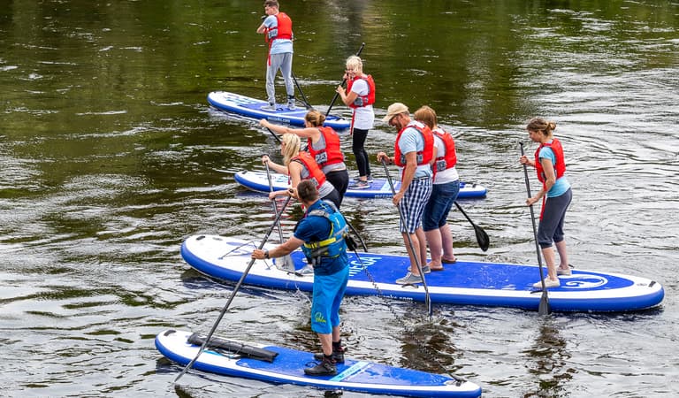 Big group enjoying a stand up paddleboard SUP experience on the river wye with inspire2adventure
