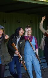 Group of ladies celebrating mid-game of laser clay pigeon shooting at Dean Laser Clay Ltd
