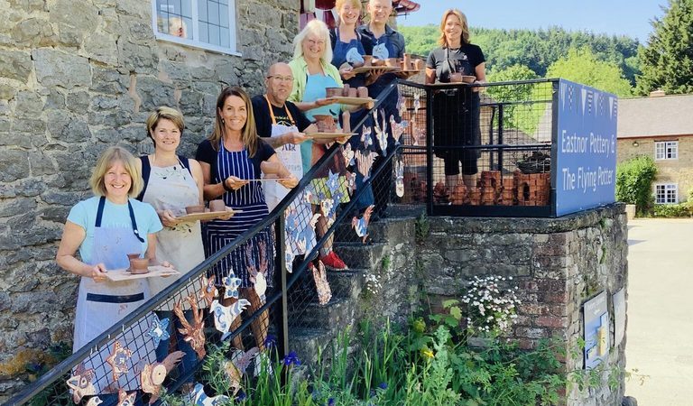 PWC group on stairs June 23 LANDSCAPE