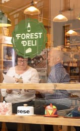 Forest Deli Tasting Corner and people enjoying the experience