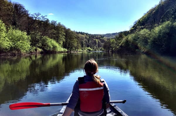 Lady on a canoe on the River Wye with Inspire2Adventure on a sunny day