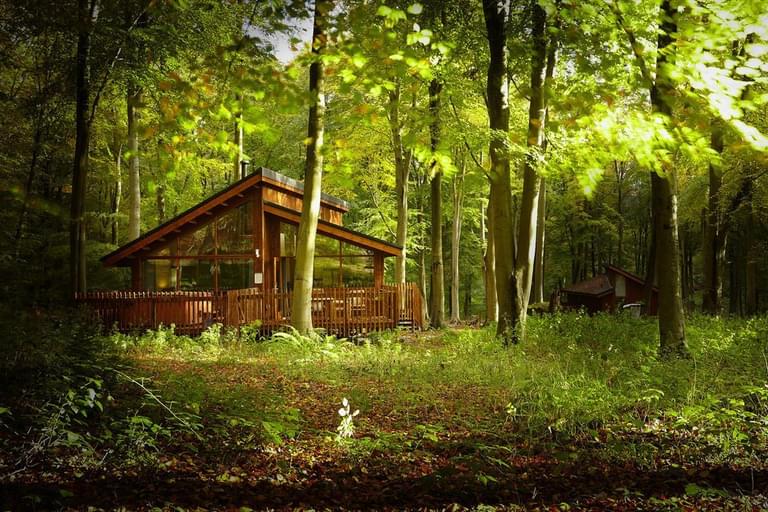 Forest Holidays log cabin in the woods in the Forest of Dean with a hot tub