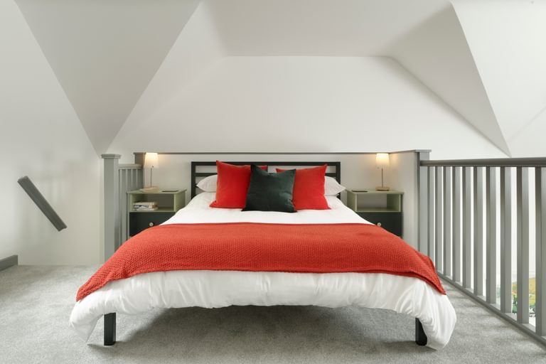 Symonds Yat Rock Lodge - open plan modern white-painted kitchen and living room with views out through French doors. Self-catering apartments in Forest of Dean.