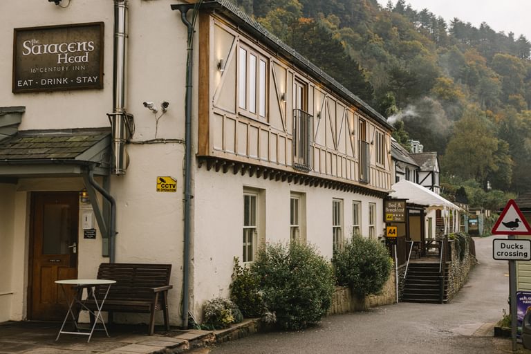 The Saracens Head Inn, Symonds Yat East, with 'Ducks Crossing' sign. A 16th Century half-timbered pub next to the River Wye with an ancient hand ferry crossing.
